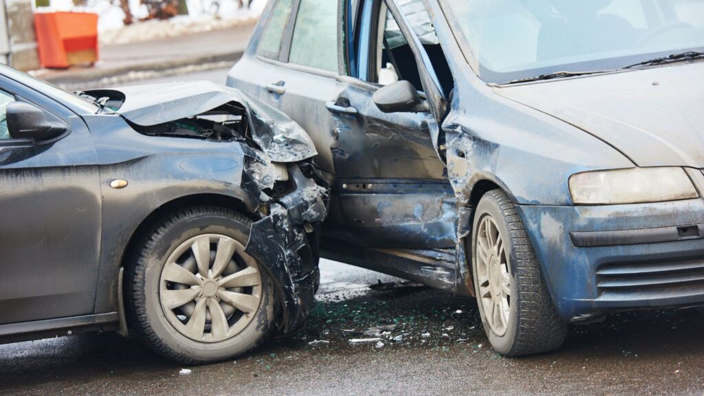 Two cars damaged in a side collision accident.