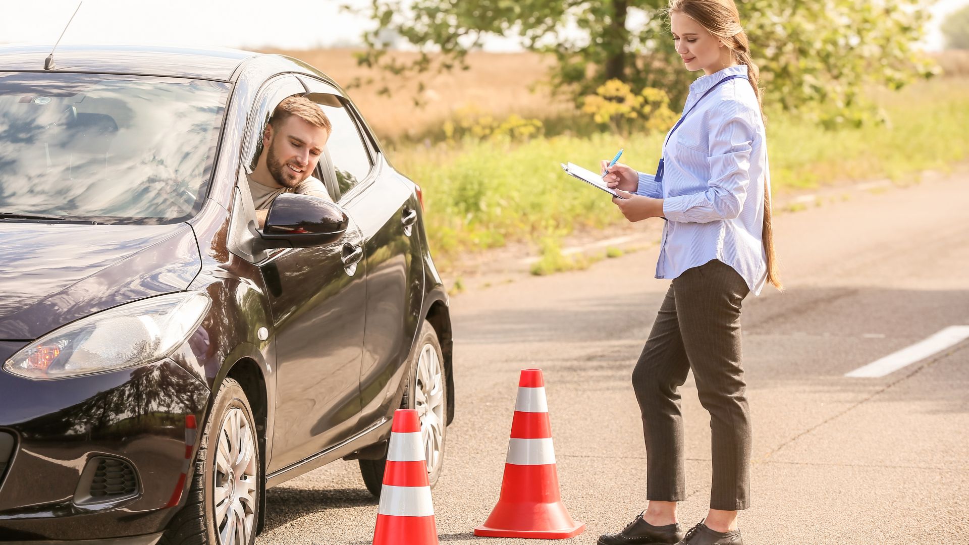 Driving instructor conducting roadside evaluation with student.