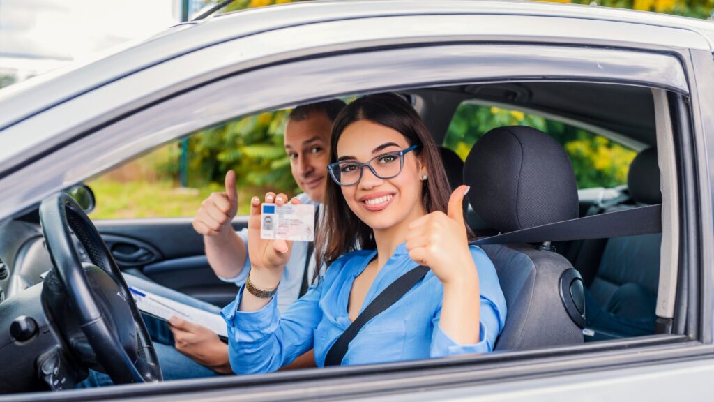 a girl showing her driving licence in camera